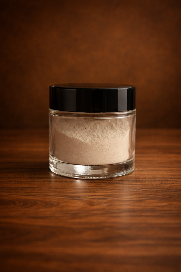 Glass jar with black lid on a wooden surface